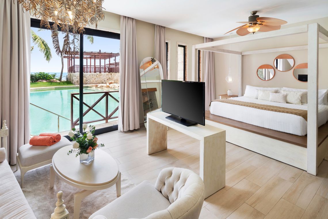 Castle Junior Suite Swim-Out king bed — Sanctuary Cap Cana